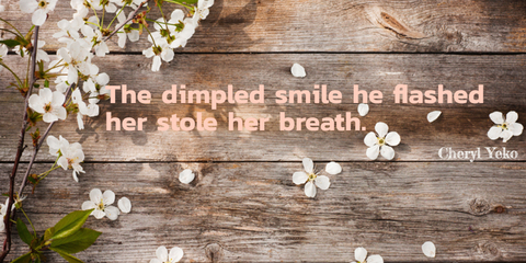 the dimpled smile he flashed her stole her breath...